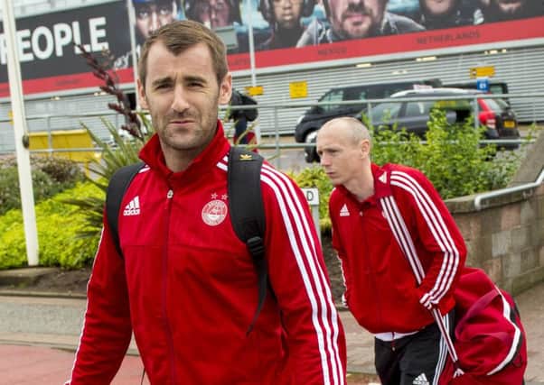 Aberdeen midfielder Niall McGinn, and teammate Willo Flood, prepare to fly out. Picture: SNS