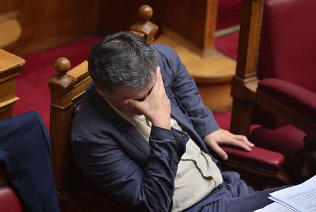 Greek finance minister Euclid Tsakalotos looks downcast. Picture: AFP/Getty