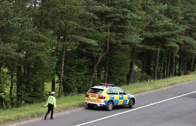 Police surveying the crash site on July 9 - three days after the crash was reported. Picture: PA