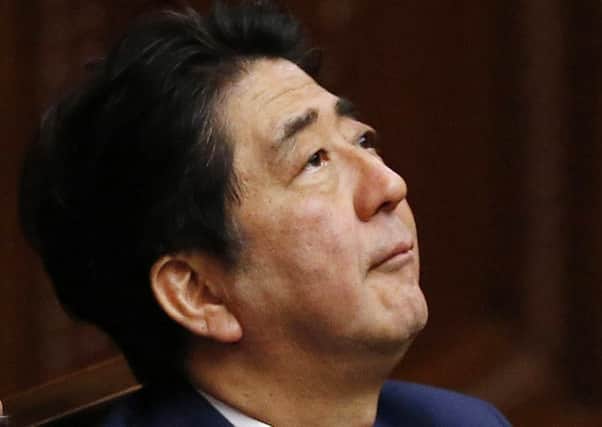 Shinzo Abe says the legislation will prevent the risk of war. Picture: AP