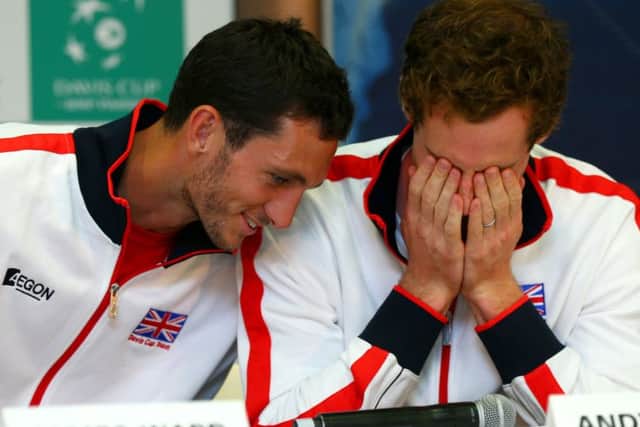 James Ward and Andy Murray share a joke at Queens Club yesterday. Picture: Getty