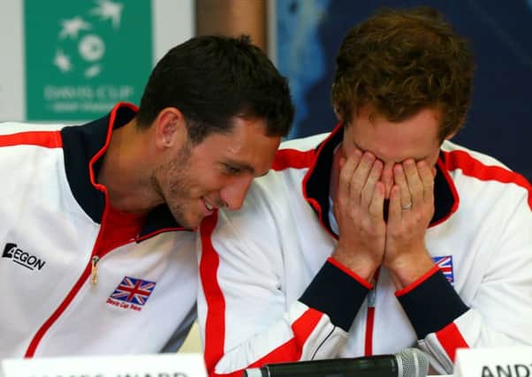 James Ward and Andy Murray share a joke at Queens Club yesterday. Picture: Getty