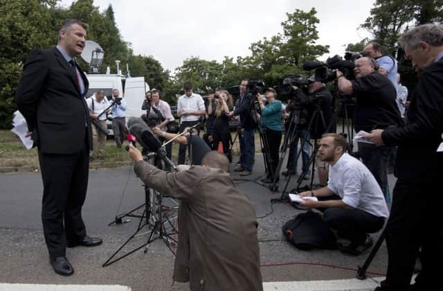 Detective Superintendent Adam Hibbert briefs the media in Findon, West Sussex. Picture: PA