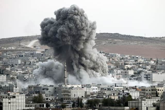Heavy smoke rises following an airstrike by US-led coalition aircraft in Kobani, Syria. Picture: Getty