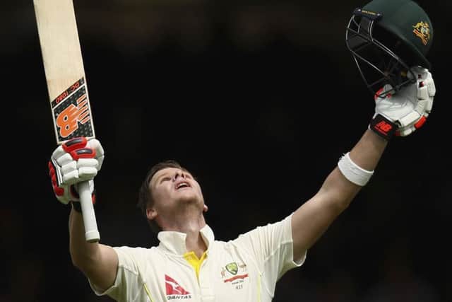 Australian batsman Steve Smith celebrates after completing his maiden double century. Picture: Getty