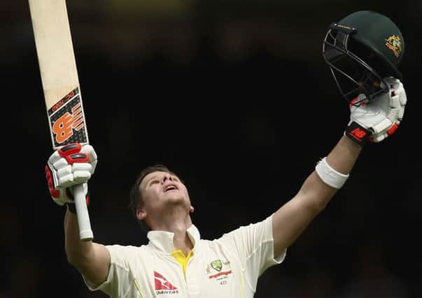 Australian batsman Steve Smith celebrates after completing his maiden double century. Picture: Getty