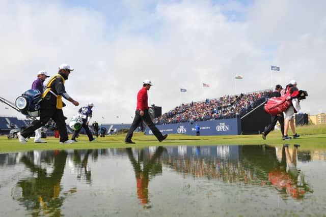 Marc Warren, Wenchong Liang and Padraig Harrington walk from the second tee yesterday. Picture: Ian Rutherford