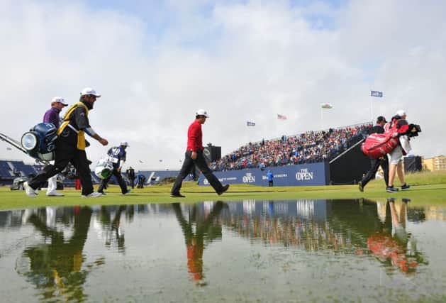 Marc Warren, Wenchong Liang and Padraig Harrington walk from the second tee yesterday. Picture: Ian Rutherford