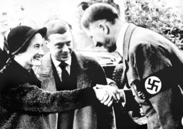 The Duke and Duchess of Windsor meet Adolf Hitler in 1937. Picture: PA