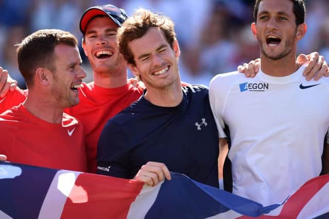 From left to right, Leon Smith, Jamie Murray, Andy Murray and James Ward celebrate the Davis Cup quarterfinal win. Picture: PA