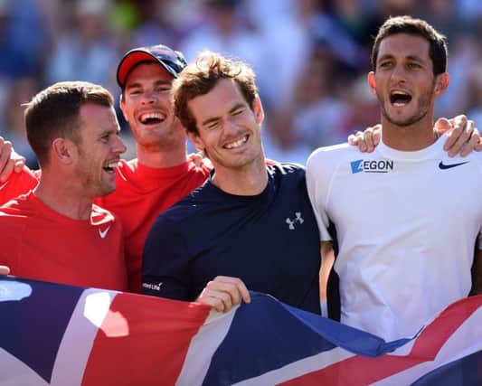 From left to right, Leon Smith, Jamie Murray, Andy Murray and James Ward celebrate the Davis Cup quarterfinal win. Picture: PA