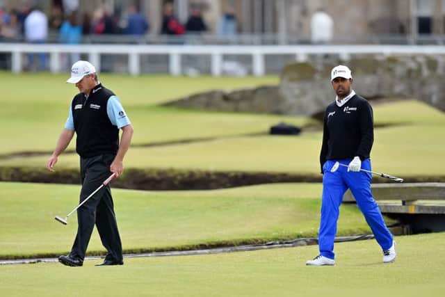 Paul Lawrie, left and Anirban Lahiri walk onto the 1st green on day five. Picture: Getty