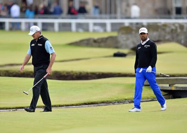 Paul Lawrie, left and Anirban Lahiri walk onto the 1st green on day five. Picture: Getty