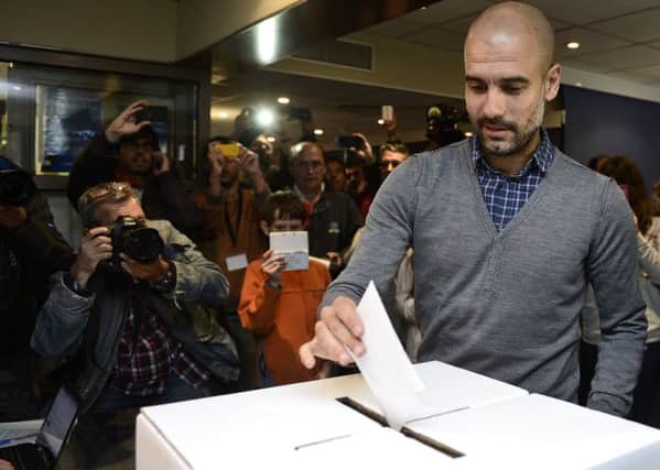 Pep Guardiola casts his vote in the symbolic ballot held in November 2014. Picture: Getty