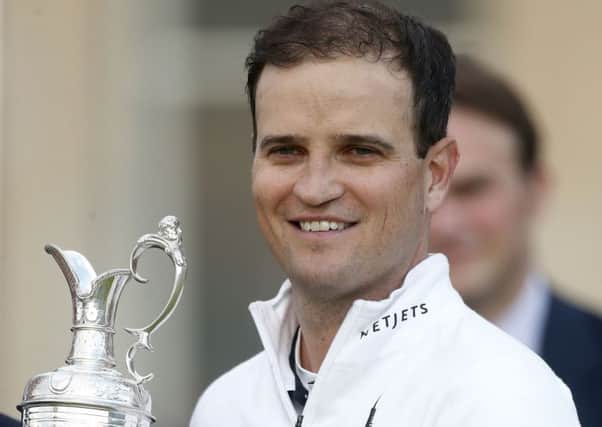 USA's Zach Johnson celebrates with the Claret Jug after winning The Open Championship 2015 at St Andrews. Picture: PA