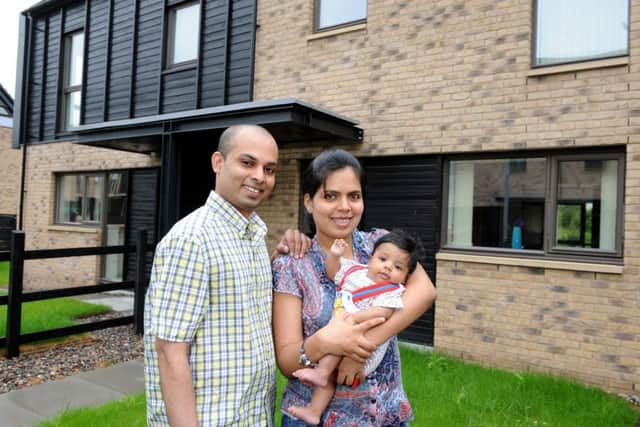Rakesh and Lakshmy Bose and their son Aditya, who bought a new home at Glasgow's Athlete's Village