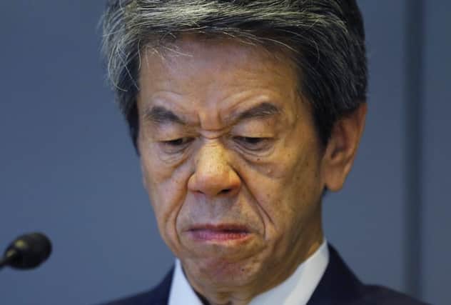 Toshiba chief executive Hisao Tanaka grimaces during a press conference to announce his resignation. Picture: AP