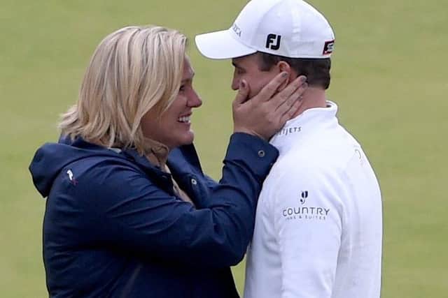 Zach Johnson with wife Kim Barclay after his win. Picture: Jane Barlow