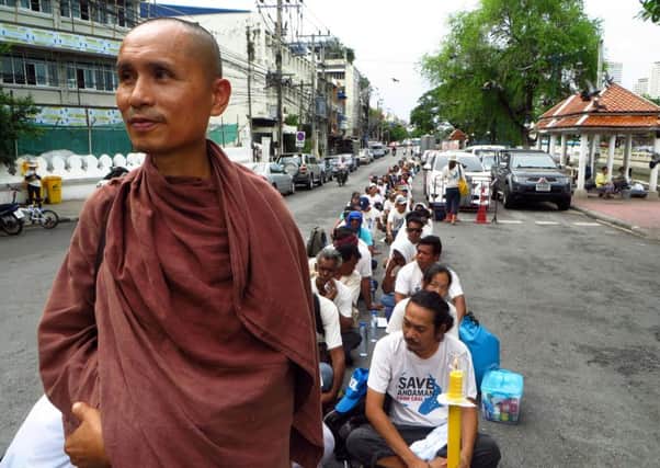 Dadodin Patavatto, a Buddhist monk, leads a march in Bangkok against the coal power plant. Picture: AP