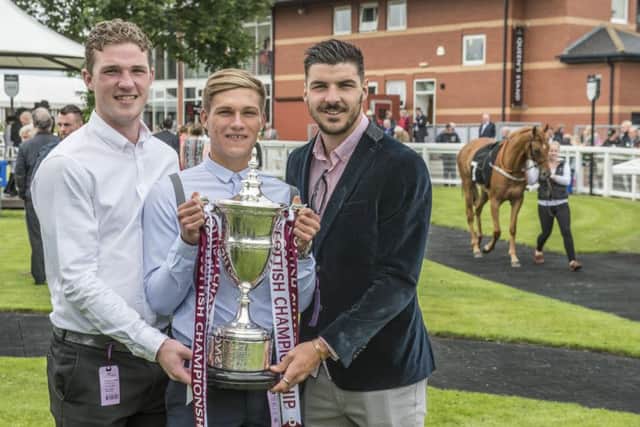 Hearts players, left to right, Jack Hamilton, Gavin Reilly and Callum Paterson at Musselburgh Races yesterday. Picture: Phil Wilkinson
