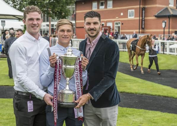 Hearts players, left to right, Jack Hamilton, Gavin Reilly and Callum Paterson at Musselburgh Races yesterday. Picture: Phil Wilkinson