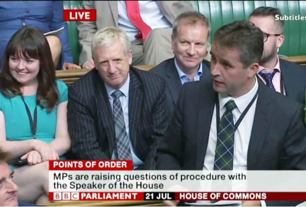 Angus MacNeil makes a point of order as his fellow SNP MPs look on from the opposition front benches. Picture: BBC Parliament