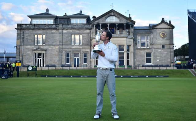 Zach Johnson kisses the Claret Jug in front of the Royal and Ancient clubhouse. Picture: Getty
