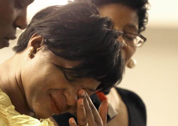 Sharon Cooper wipes away tears at a memorial service for her sister Sandra Bland. Picture: AP