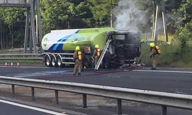 Fire crews attending a tanker lorry that caught fire on the M90. Picture: Twitter