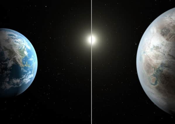 This artist's rendering made available by NASA on Thursday, July 23, 2015 shows a comparison between the Earth, left, and the planet Kepler-452b. Picture: Nasa/AP