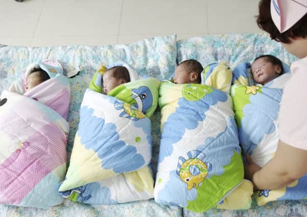 China is considering scrapping its Draconian one-child policy, just as Britain introduces disincentives to creating bigger families. Picture: Imaginechina/REX