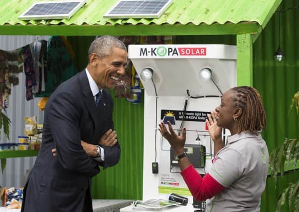 President Obama talks about his solar energy scheme at a Nairobi innovation fair. Picture: AFP/Getty
