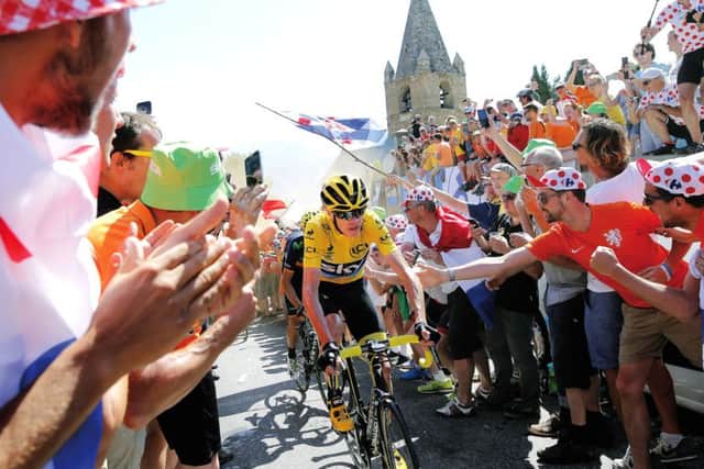 Chris Froome, in yellow jersey, climbs towards Alpe dHuez during the 20th stage of the Tour. Photograph: AP