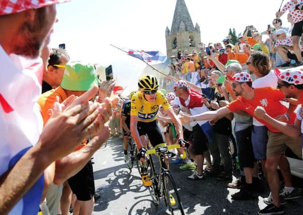 Chris Froome, in yellow jersey, climbs towards Alpe dHuez during the 20th stage of the Tour. Photograph: AP