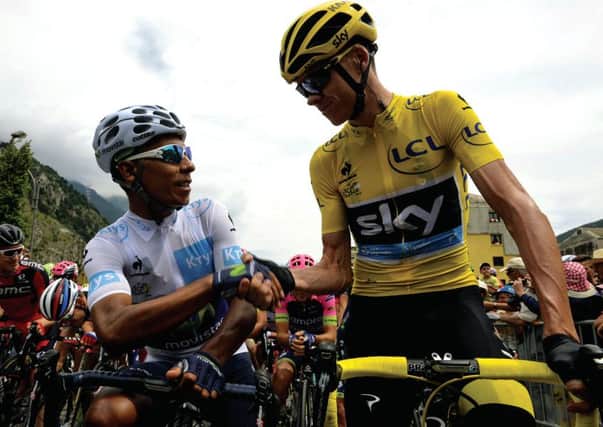 Colombia's Nairo Quintana (left) shakes hands with Great Britain's Chris Froome, wearing the overall leader's yellow jersey. Picture: AFP/Getty Images
