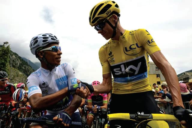Colombia's Nairo Quintana (left) shakes hands with Great Britain's Chris Froome, wearing the overall leader's yellow jersey. Picture: AFP/Getty Images