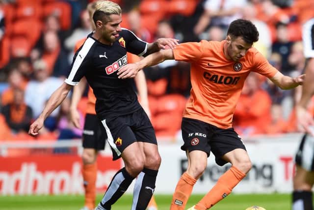 Dundee United youngster Scott Fraser takes the ball away from Valon Behrami of Watford. Picture: Bill Murray/SNS