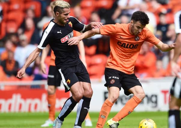 Dundee United youngster Scott Fraser takes the ball away from Valon Behrami of Watford. Picture: Bill Murray/SNS