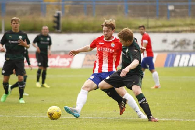 Cowdenbeaths Chris Kane, left, tussles for possession with Raith Rovers midfielder Ryan McCord in a tempestuous cup contest at Central Park. Picture: Sportspix