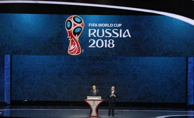 FIFA President Sepp Blatter, right, and Russian President Vladimir Putin open the preliminary draw for the 2018 soccer World Cup in Konstantin Palace in St Petersburg, Russia. Picture: AP