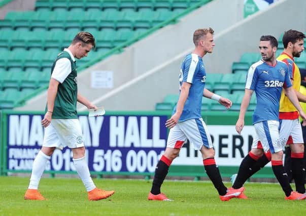 Scott Allan (left) during the Petrofac Training Cup First Round leg against Rangers at Easter Road. Picture: Neil Hanna
