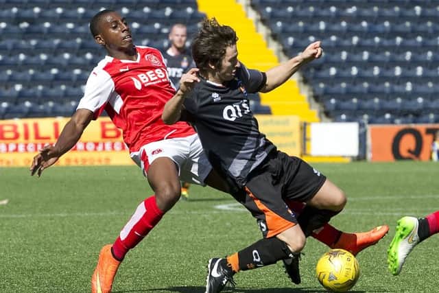 Kilmarnock's Chris Johnston (right) is tackled from behind in match against Fleetwood Town. Picture: SNS Group