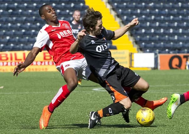 Kilmarnock's Chris Johnston (right) is tackled from behind in match against Fleetwood Town. Picture: SNS Group