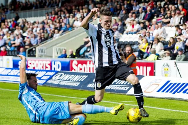 Berwicks Ewan McNeil, left, slides in on Lewis Morgan during Saturdays cup clash at St Mirren Park. Picture: SNS Group