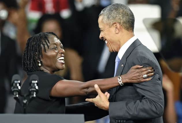 Barack Obama is embraced by half-sister Auma. Picture: AFP/Getty