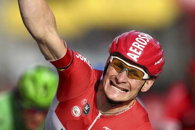 Germany's Andre Greipel celebrates as he crosses the finish line to win  the twenty-first and last stage of the Tour de France cycling race over 109.5 kilometers (68 miles) with start in Sevres and finish in Paris, France, Sunday, July 26, 2015. P