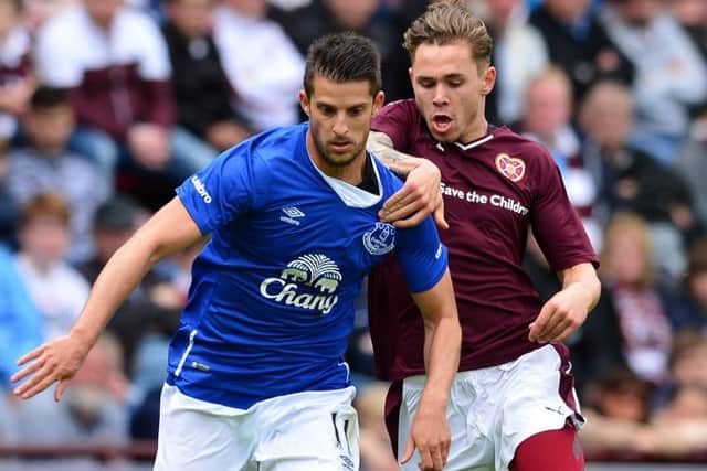 Sam Nicholson struggles to keep pace with Evertons Kevin Mirallas. Picture: Getty