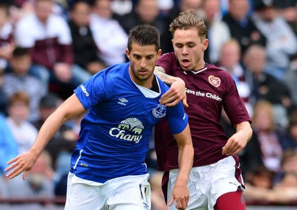 Sam Nicholson struggles to keep pace with Evertons Kevin Mirallas. Picture: Getty