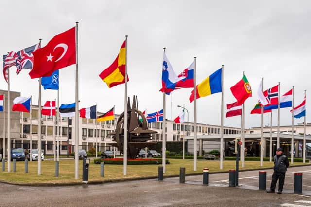 The flags of Nato member states are flown outside its headquarters in Brussels. Picture: AP