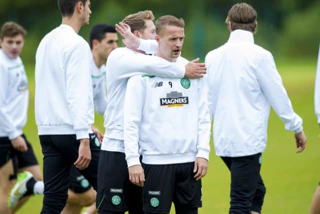 Kris Commons gets to grips with Celtic team-mate Leigh Griffiths. Picture: SNS